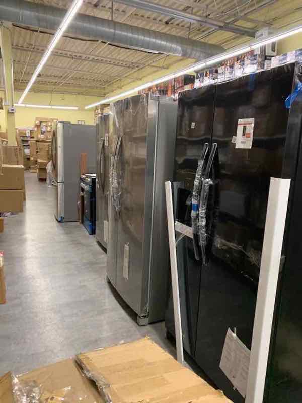 Aisle of major appliances in the warehouse