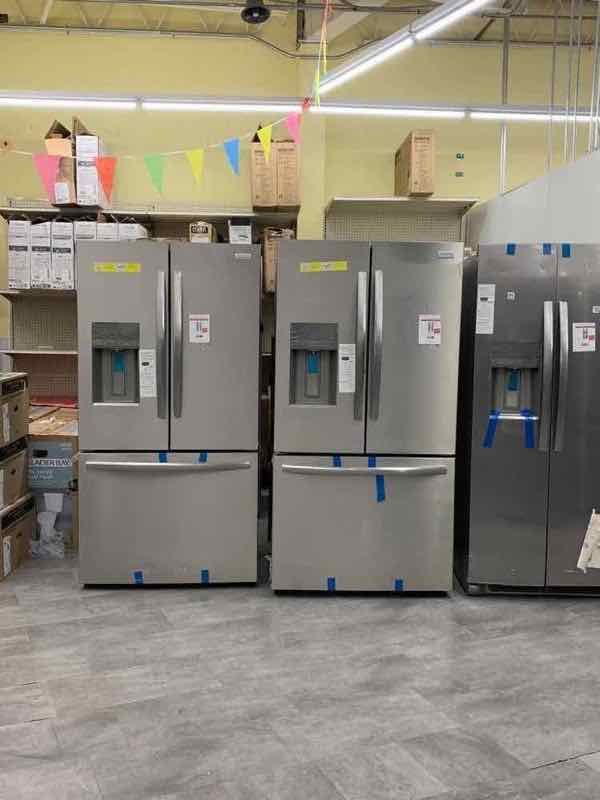 Three French-door refrigerators side by side
