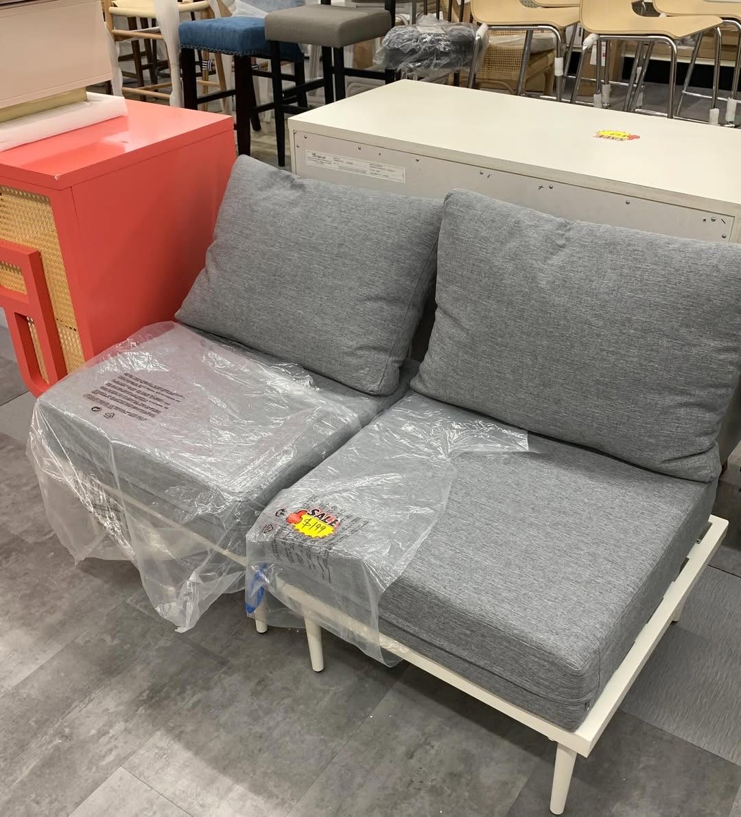 Grey upholstered loveseat