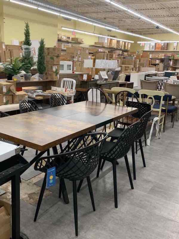 Dining tables and chairs on the warehouse showroom floor