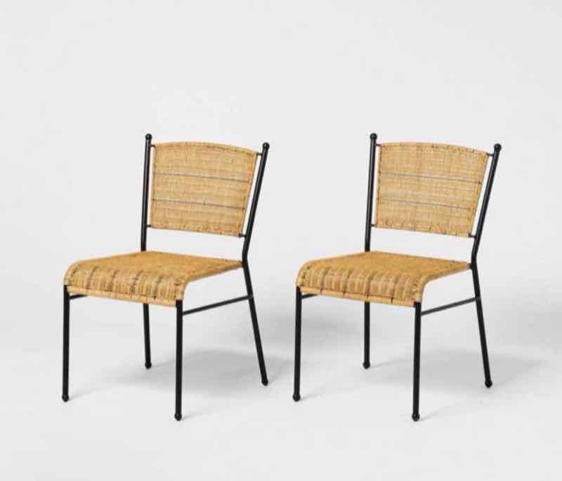 Pair of natural rattan side chairs with black metal frames