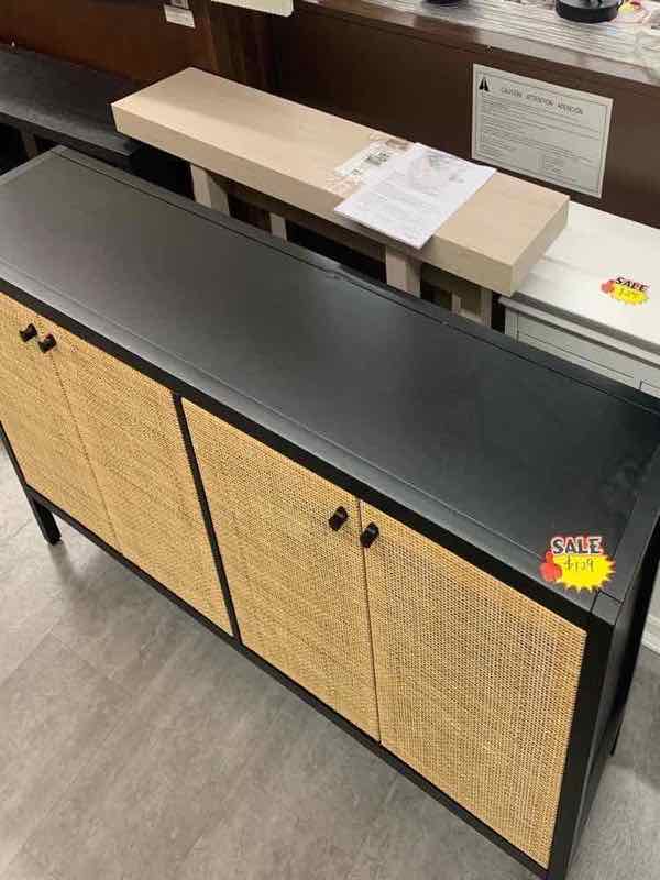 Black sideboard with rattan-front doors