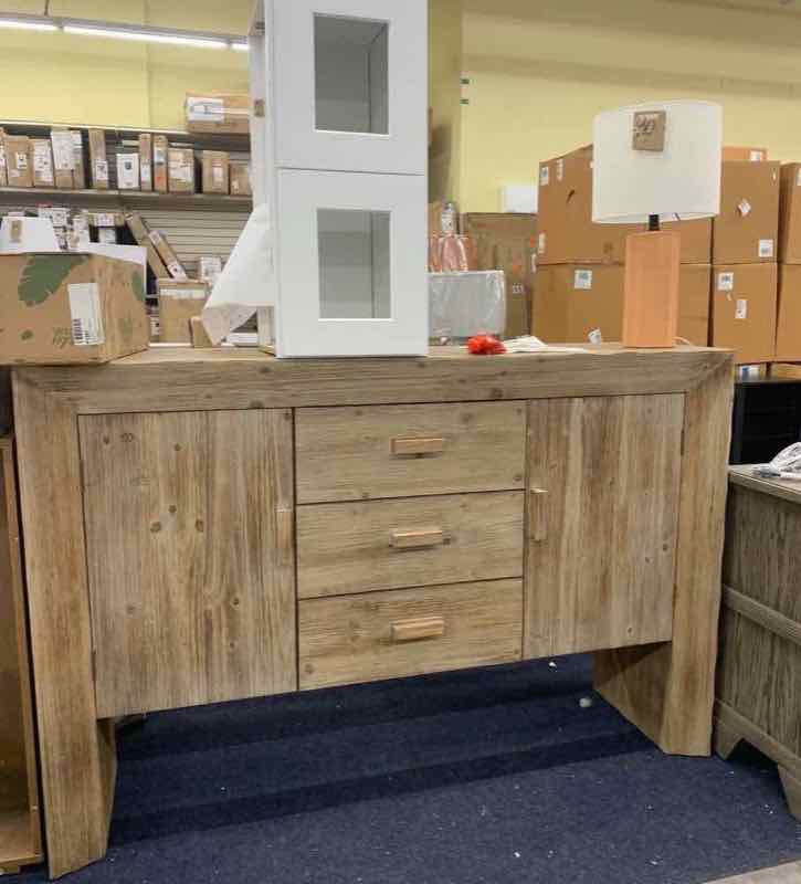 Wood sideboard with table lamp and styled vignette